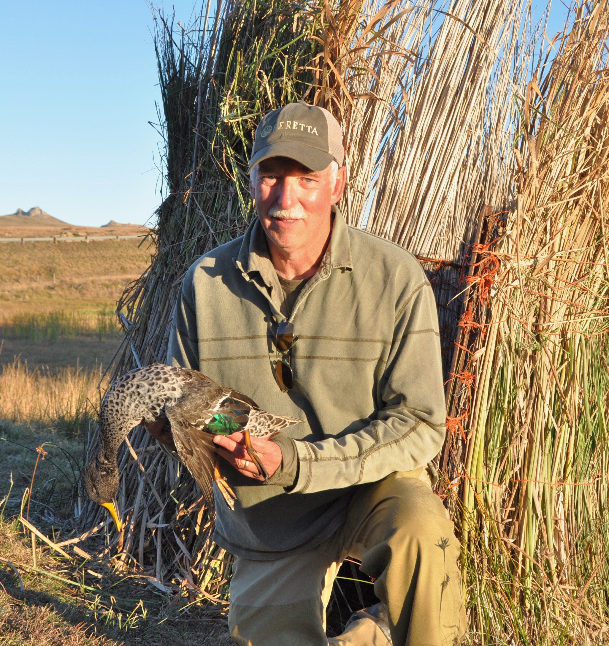 The author with a yellow-billed duck. It’s perfect when they arrive in twos and threes.
