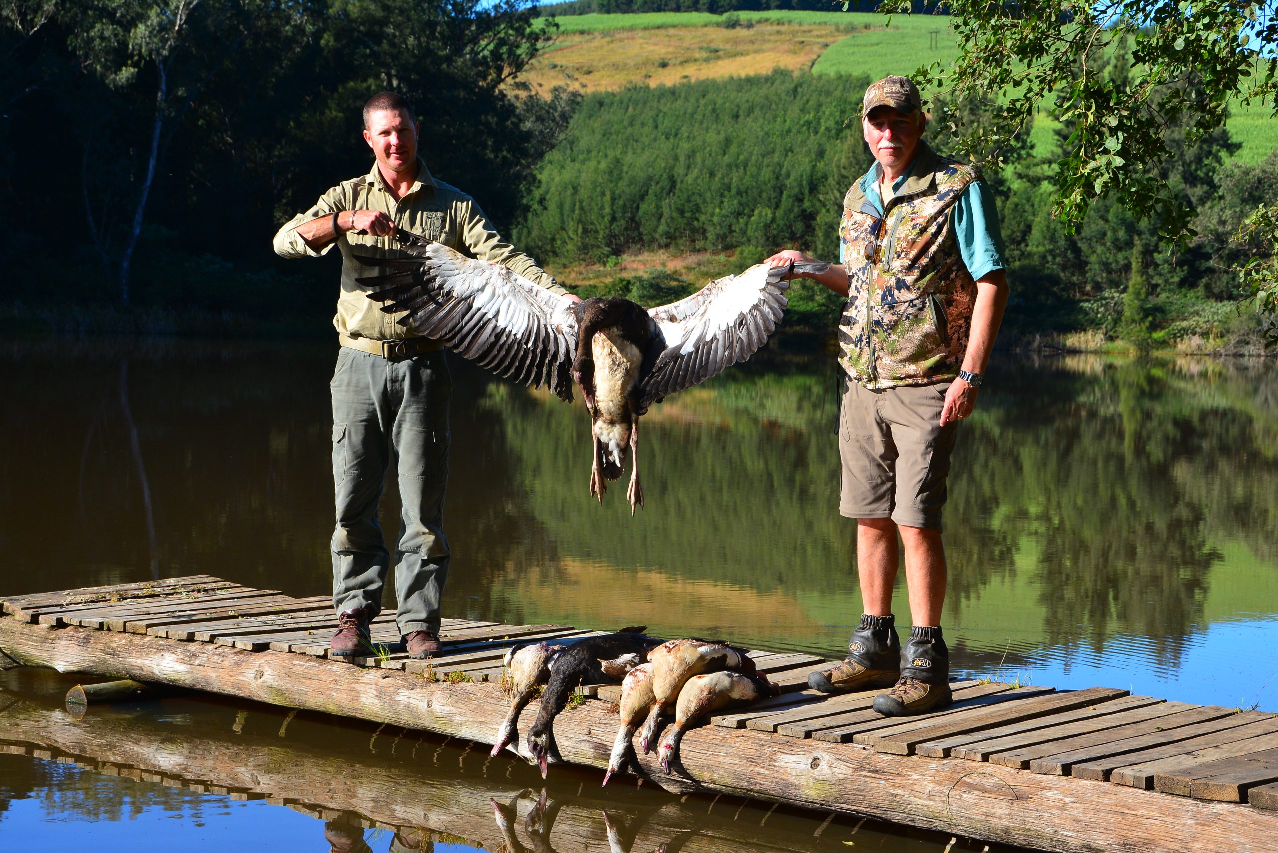PH Dylan Holmes and the author with a spur-winged goose. The wingspan is enormous. 