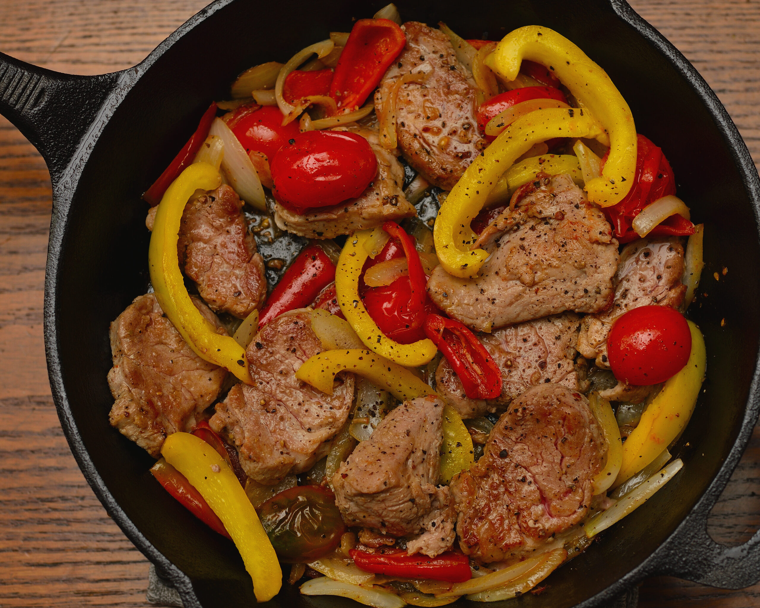 Warthog Fillet with Red Peppers and Onions