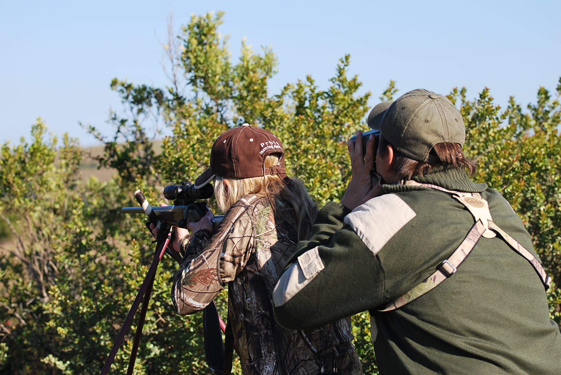 DSC_0596 Hunting with PH Carl Van Zyl, Donna Boddington prepares to take a shot at a Burchell’s zebra.