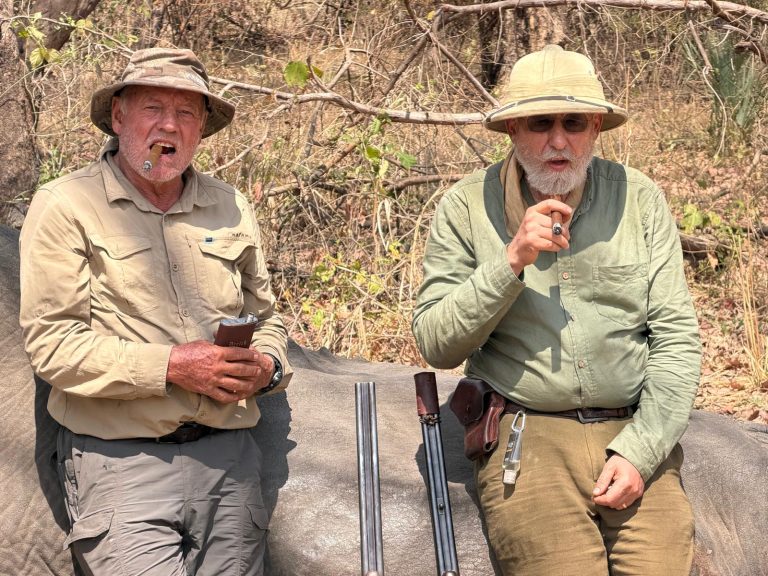 Smoking a cigar and swigging from the hipflask after a gruelling 13th day elephanthunt on foot 768x576